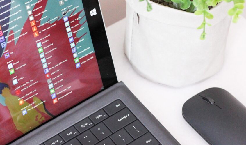 black laptop computer beside black wireless mouse