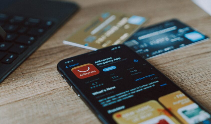 black and orange card on brown wooden table