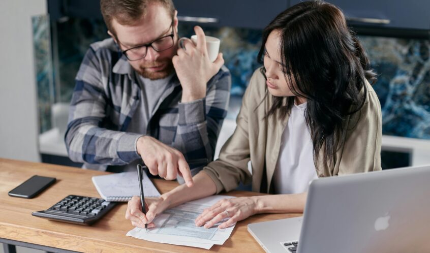 Free couple calculating al their bills stock photo